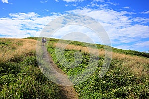 Pathway uphill with two women photo