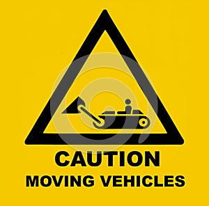 Moving vehicles and equipments, caution. Safety sign