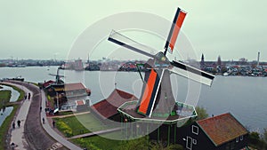 A moving windmil of the Zaans Museum in Amsterdam, Netherlands. Riverbank concept