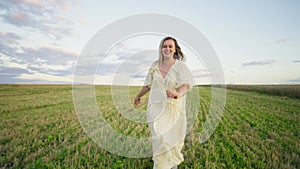 The mowed wheat field becomes a place for a woman to run freely.