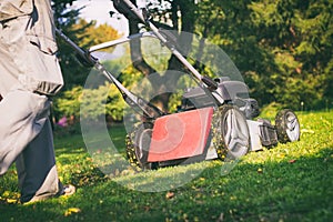 Mowing the grass with a lawn mower