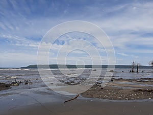 Moyo island is visible close across the beach photo