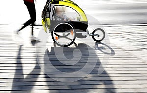 Moyther with yellow pram photo