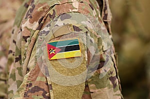 Mozambique flag on soldiers arm. Mozambique troops collage