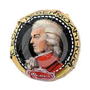 Mozartkugel closed up wrapped into foil with portrait of Mozart.