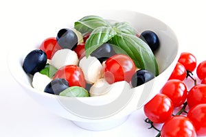 Mozzarella, black olives and tomato salad