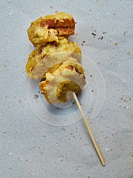Mozzarella in carrozza on a rustic paper. photo