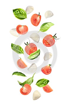 Mozzarella cheese balls, tomatoes and basil leaves falling on background. Caprese salad