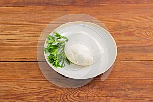 Mozzarella cheese with parsley on a saucer