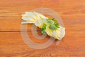 Mozzarella cheese in the shape of a plait and parsley