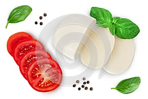 Mozzarella cheese sliced with basil leaf and tomato isolated on white background with clipping path. Top view. Flat lay