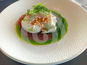 Mozzarella di Bufala Campana with green sauce in a plate photo