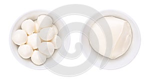 Mozzarella, mini balls (bambini bocconcini) and a big ball, in white bowls