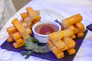 mozzarella sticks overflowing with red sauce photo