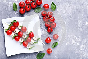 Mozzarella, tomatoes and basil leafs