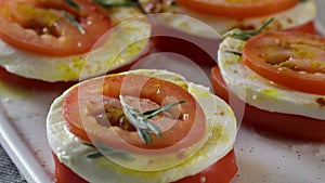 Mozzarella and tomatoes. Scene. Slices of fresh tomato and mozzarella cheese. Salad with mozzarella and tomatoes -