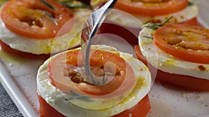 Mozzarella and tomatoes. Scene. Slices of fresh tomato and mozzarella cheese. Salad with mozzarella and tomatoes -