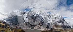 77MP Panoramic photo Mera peak 6476m with glacier lakes and snowy summits covered in white clouds. Himalayas climbing route near photo