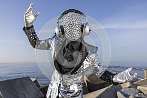 Mr disco man with sparkly face and headphones