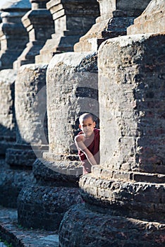 Mrauk U, MYANMAR - DEC 15, 2014: Young Novice monk and smile in