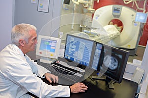 MRI technologist monitoring screen