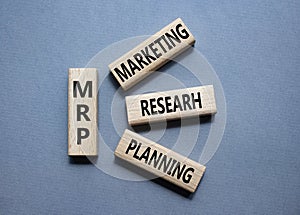 MRP - Marketing Research Planning symbol. Concept word MRP on wooden cubes. Beautiful grey background. Business and MRP concept.