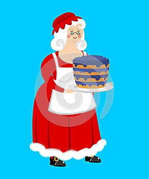 Mrs. Claus and blueberry cake. Wife of Santa Claus and dessert.