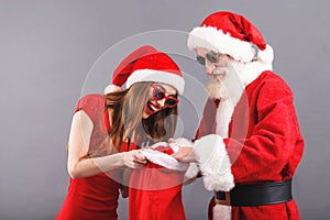 Mrs. Claus Searching Some Presents In The Santa Claus Bag