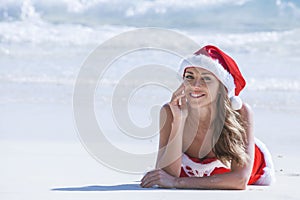 Mrs. Claus on tropical beach