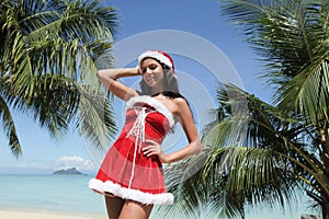 Mrs. Claus on tropical beach