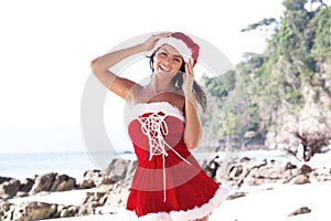 Mrs. Claus on tropical beach