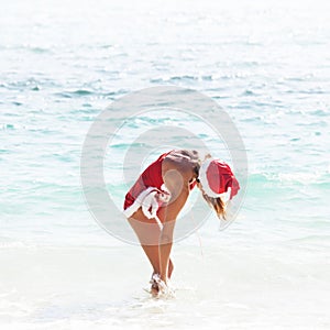 Mrs. Claus on tropical beach