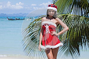 Mrs. Claus on tropical beach