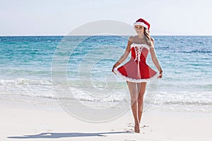 Mrs. Claus on tropical beach