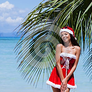 Mrs. Claus on tropical beach