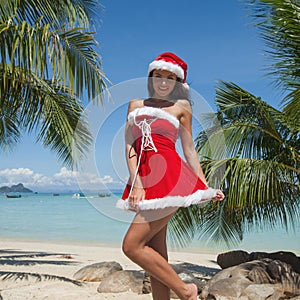 Mrs. Claus on tropical beach