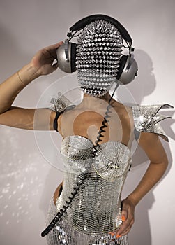 Mrs disco woman with sparkly face and headphones