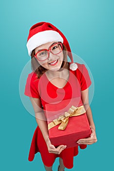 Mrs. Santa. Beautiful young asian woman in santa`s hat holding a