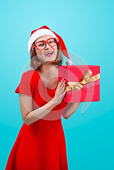 Mrs. Santa. Beautiful young asian woman in santa`s hat holding a