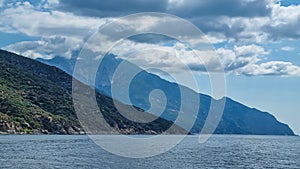 Mt Athos - Boat tour with panoramic view over the Mediterranean Aegean Sea. Looking the coastline of peninsula Athos, Chalkidiki