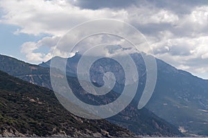 Mt Athos - Scenic view on the cloud covered mountain peak of Mount Athos in Autonomous State of Holy Mountain, Chalkidiki, Greece