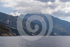 Mt Athos - Scenic view on the cloud covered mountain peak of Mount Athos in Autonomous State of Holy Mountain, Chalkidiki, Greece