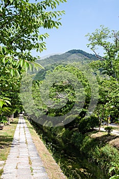 Mt. Daimonji and Canal of fresh verdure near Ginkakuji-michi, Kyoto, Japan