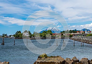 Mt Edgecumbe rises about the small town of Sitka in Alaska photo