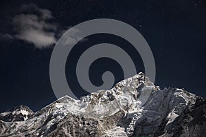 Mt. Everest and Lhotse beneath a star filled night sky