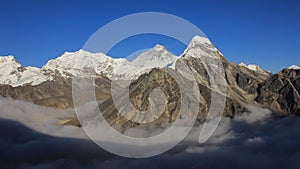 Mt Everest and other high mountains surrounded by a sea of fog