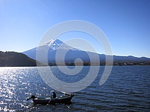 Mt. Fuji with a Boater Out on Lake in Front of Mountain