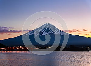 Mt. Fuji at dusk over Lake Kawaguchi in Japan. Generated AI