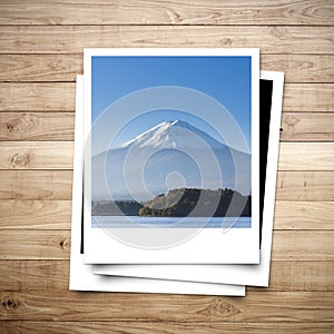 Mt. Fuji Japan memory on photo frame brown wood plank background