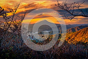 Mt. Fuji over Lake Kawaguchiko with autumn foliage at sunrise in Fujikawaguchiko, Japan